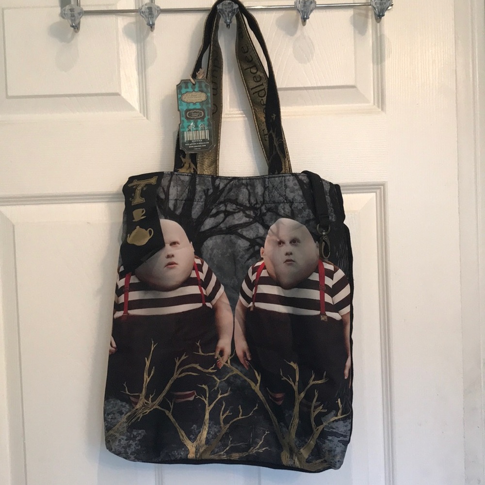Alice in Wonderland bag Disney. 13” by 15”

10” the strap of the bag